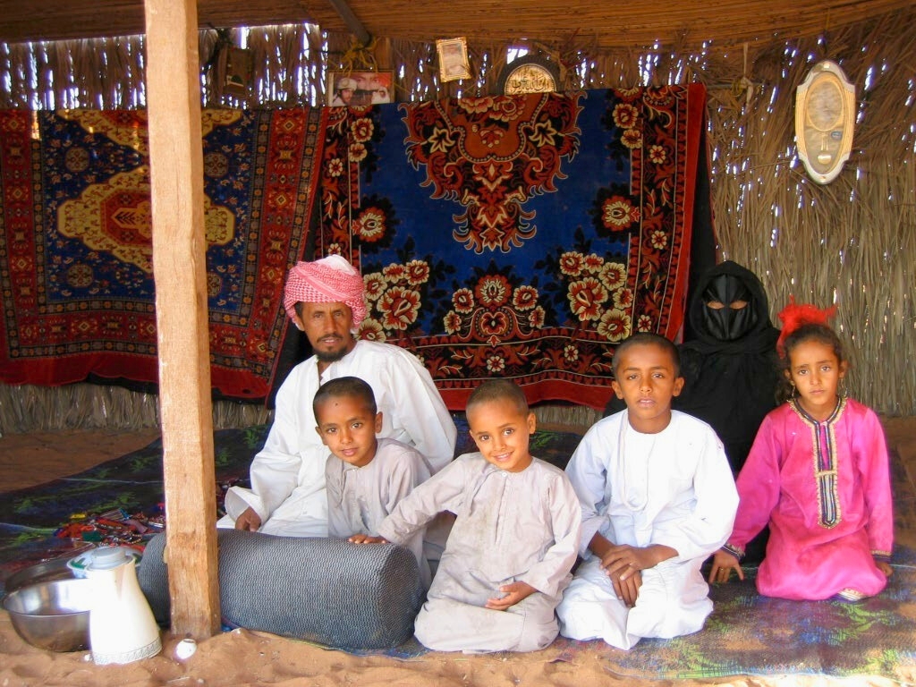 Bedouin family in a traditional Omani tent