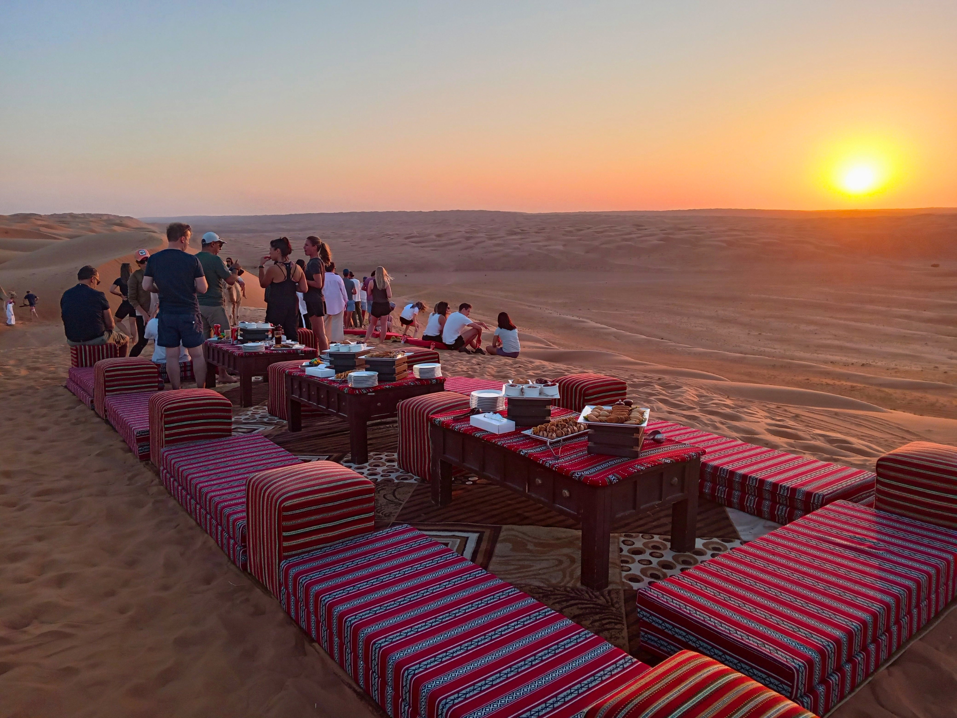 Bedouin-style desert sunset dining setup